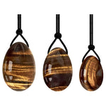 Ielādēt attēlu galerijas skatītājā, Akmens Tīģeracs / Yoni Ola Tīģeracs / Yoni Egg Tiger Eye with Hole 2x3cm / 2.5x4cm / 3x4.5cm