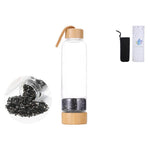 Ielādēt attēlu galerijas skatītājā, Stikla pudele ar kristāliem Ametists / Kalnu Kristāls / Obsidiāns / Rozā Kvarcs / Tīģeracs 7x24.5cm 550ml