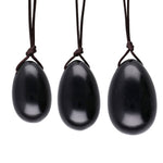 Load image into Gallery viewer, Akmens Obsidiāns / Yoni Ola Melnais Obsidiāns / Yoni Egg Black Obsidian with Hole 2x3cm / 2.5x4cm / 3x4.5cm
